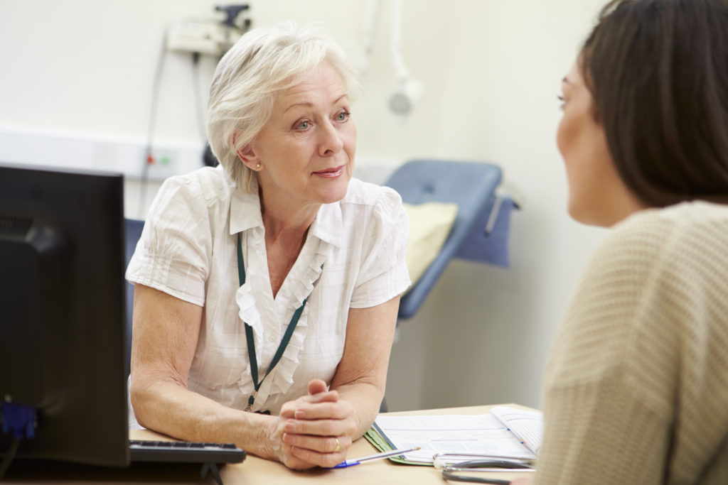 Female,Consultant,Meeting,With,Teenage,Patient